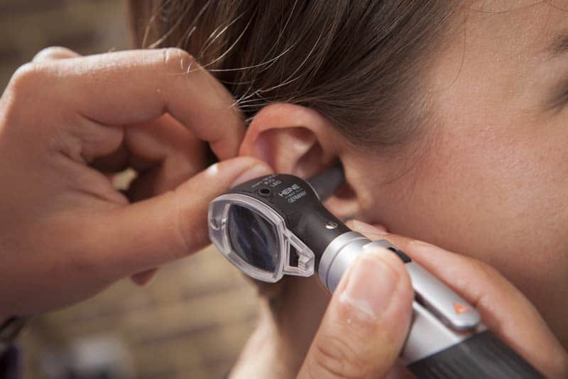 woman having her hearing tested woman having her hearing tested